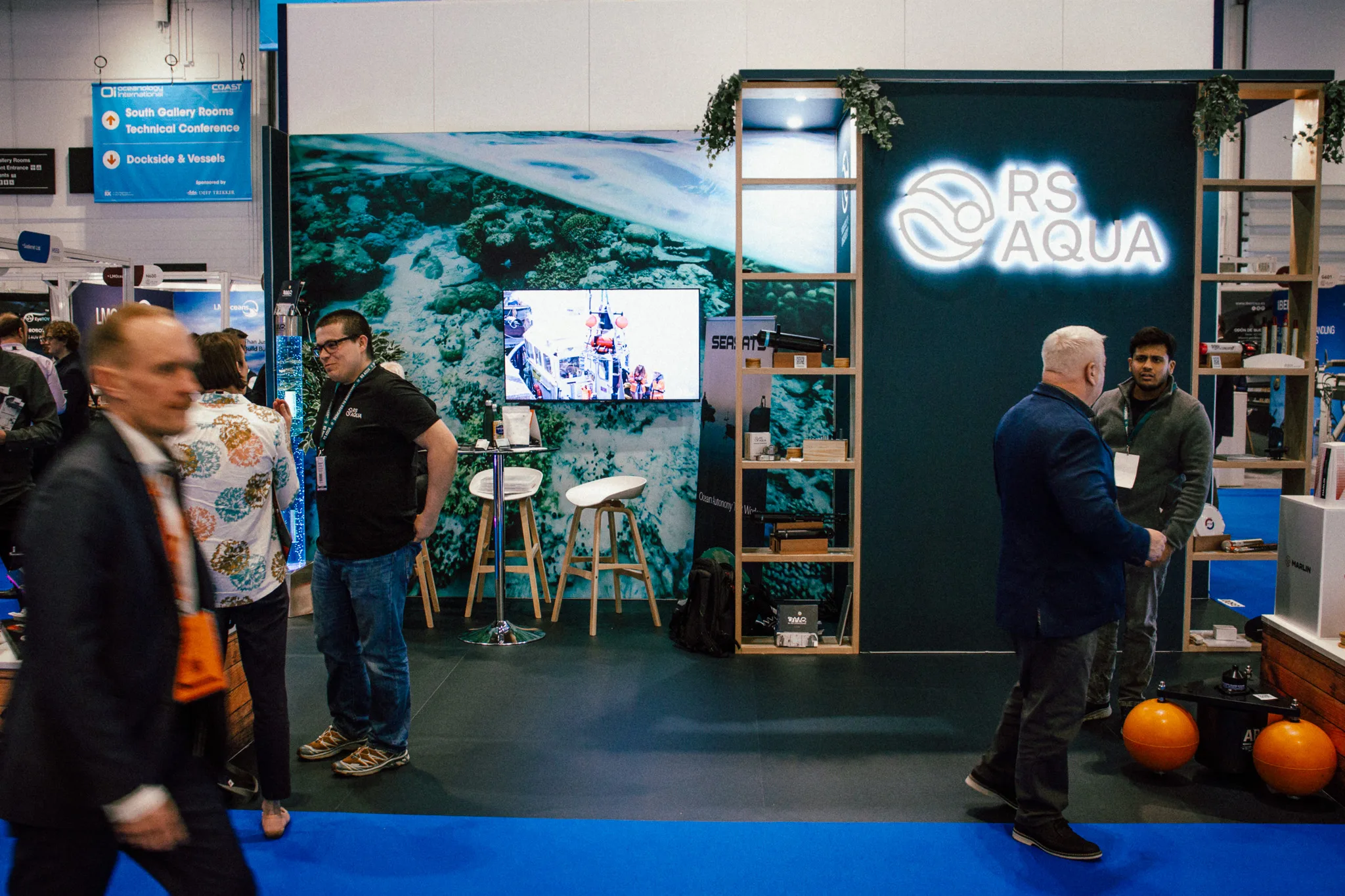 RS Aqua's latest trade show booth, with sales representatives talking to visitors